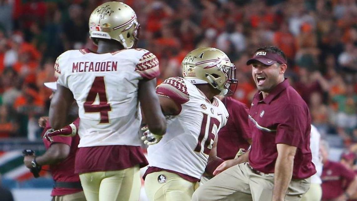 Florida State Seminoles defensive back Tarvarus McFadden, 4, is congratulated by teammates and coaches after blocking a field goal against University of Miami Hurricanes in the fourth quarter of an NCAA college football game at Hard Rock Stadium on Sat., Oct. 8, 2016, in Miami Gardens.
