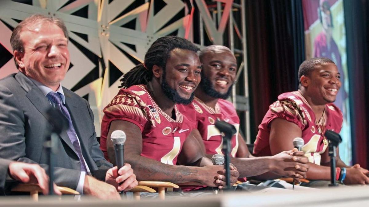 Florida State University Head Coach Jimbo Fisher, from left, shares a laugh with his players Dalvin Cook, Roderick Johnson and DeMarcus Walker at the annual Orange Bowl Coaches Luncheon at Jungle Island on Thurs., Dec. 29, 2016