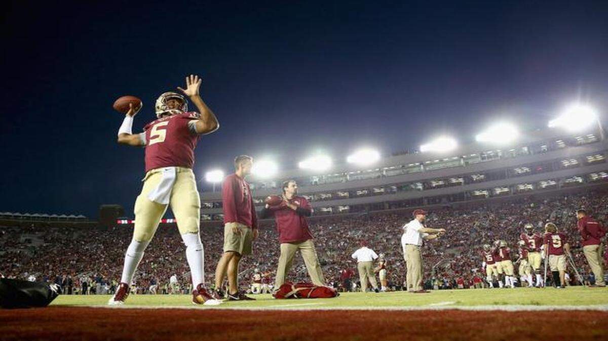 <cutline_leadin>Center of attention: </cutline_leadin>FSU quarterback Jameis Winston warms up before the No. 2 Seminoles played No. 5 Notre Dame on Saturday night.