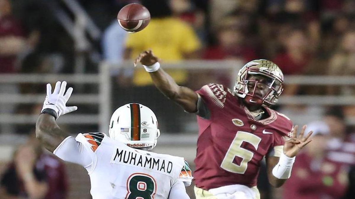 
Florida State quarterback Everett Golson (6) throws over Miami defensive lineman Al-Quadin Muhammad (8) at Doak Campbell Stadium in Tallahassee, Fla., on Saturday, Oct. 10, 2015. 
