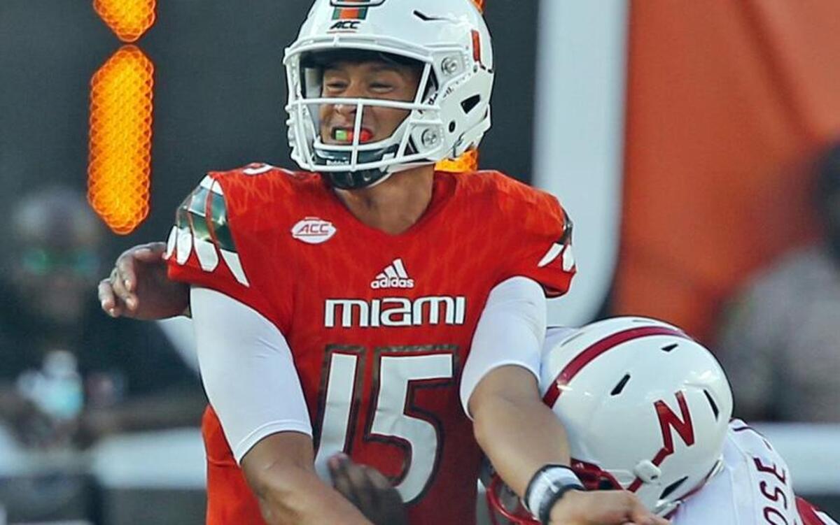 
UM quarterback Brad Kaaya is hit by Nebraska's Jonathan Rose after a throw in the third quarter at Sun Life Stadium in Miami Gardens, Fla., on Saturday, Sept. 19, 2015. 
