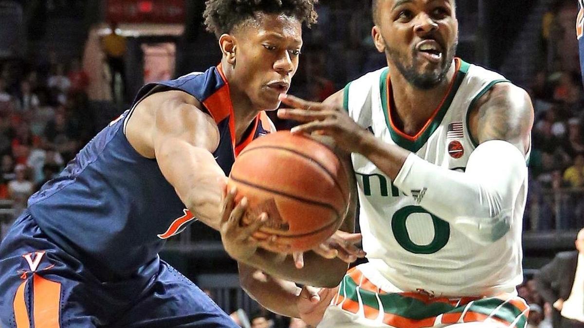 Virginia Cavaliers forward De’Andre Hunter (12), seen here defending former UM guard Ja’Quan Newton in a game last season, is among a bunch of forwards who could be options for the Heat in the first round of the NBA Draft.