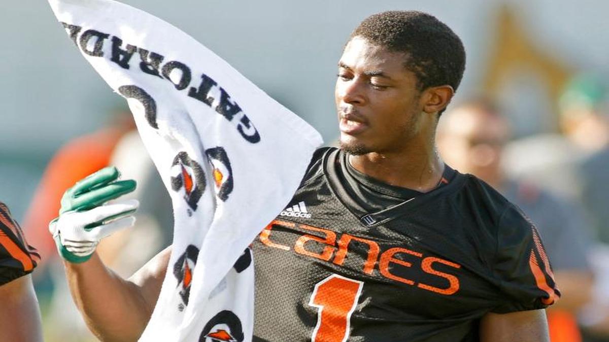
Miami defensive back Artie Burns flips a towel during a break at the team's NCAA college football practice, Friday, Aug. 7, 2015, in Coral Gables, Fla. 
