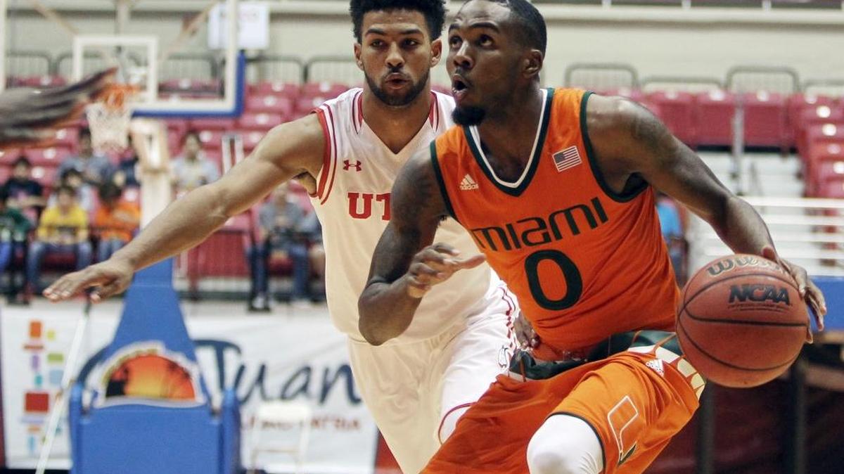 UM guard Ja’Quan Newton (0) drives against Utah guard Isaiah Wright during the first half of a Puerto Rico Tip-Off tournament game in San Juan, Puerto Rico, Friday, Nov. 20, 2015.