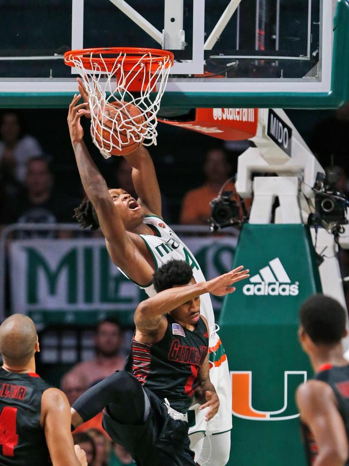 Miami guard Lonnie Walker IV (4) dunks the ball against Gardner Webb guard David Efianayi during the first half of an NCAA college basketball game, Fri., Nov. 10, 2017, in Coral Gables, Fla.
