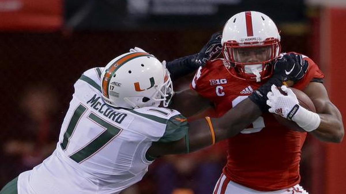 <cutline_leadin>Stampede: </cutline_leadin>Nebraska running back Ameer Abdullah runs past Miami linebacker Tyriq McCord for some of his 121 yards on 19 carries in the first half.