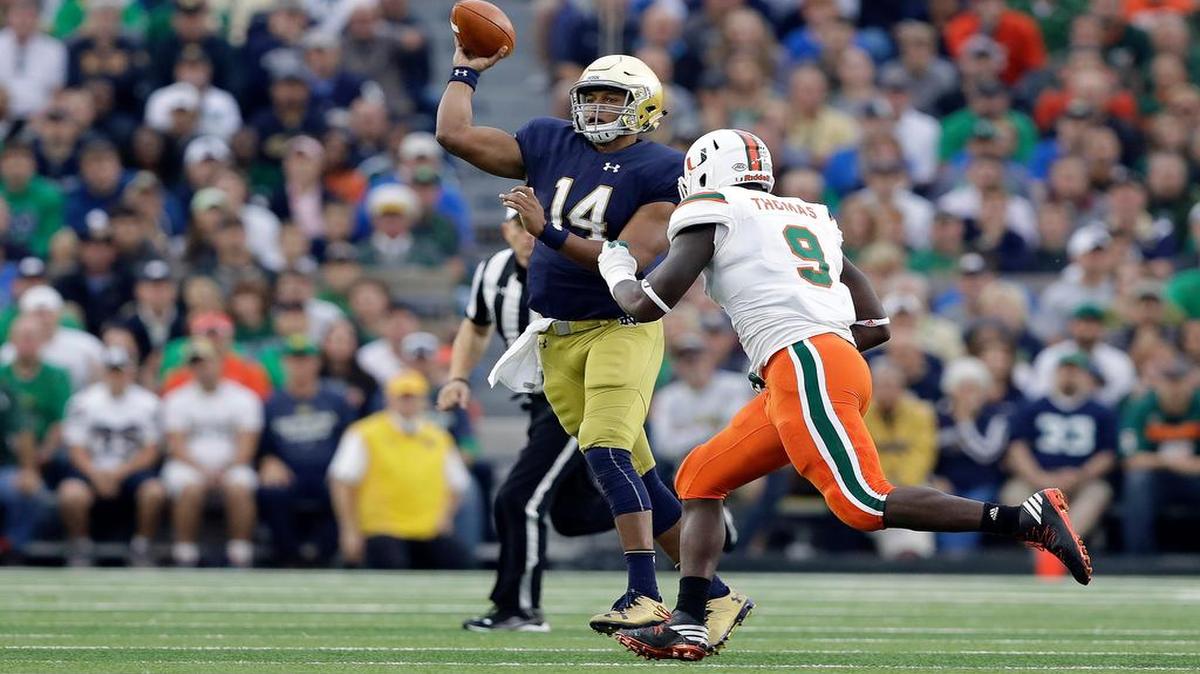 Defensive end Chad Thomas, right, has four sacks this season and leads the Hurricanes with 10 tackles for loss.