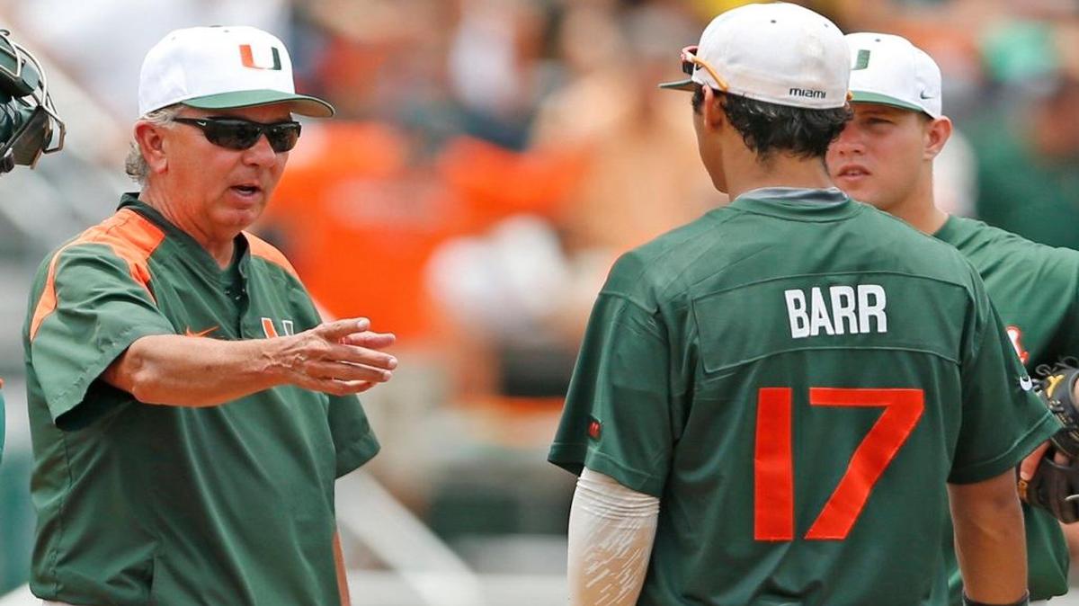 UM coach Jim Morris talks to first baseman Chris Barr during a Super Regional game against Virginia Commonwealth at Mark Light Field in Coral Gables on Saturday, June 6, 2015.