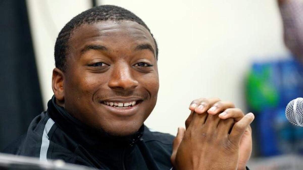 
University of Miami running back Duke Johnson reacts to a reporter's question during a news conference in Shreveport, La. on Dec. 26, 2014. The Hurricanes face South Carolina in the Independence Bowl NCAA college football game on Saturday.
