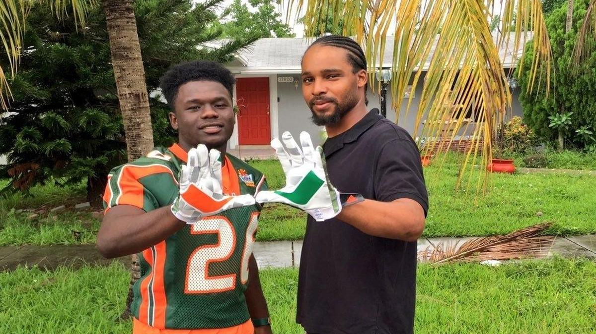Columbus High cornerback Trajan Bandy, a UM commitment, poses with Jamal Johnson, right, the half-brother of the late Sean Taylor.