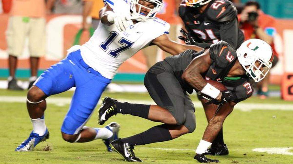 On Saturday:  Miami’s Stacy Coley returns a kick as Duke’s Issac Blakeney tries to tackle him in the first quarter.
