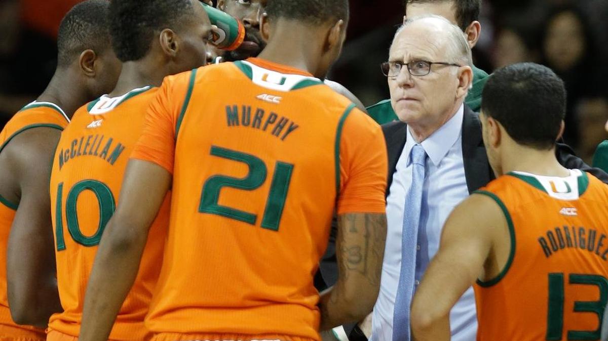 Miami head coach Jim Larrañaga gathers his team after calling a timeout late the first half against Boston College, Wednesday, Jan. 20, 2016, in Boston.