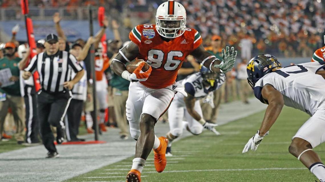 Miami Hurricanes tight end David Njoku runs toward the end zone against West Virginia during the Russell Athletic Bowl in Orlando Wed., Dec. 28, 2016.