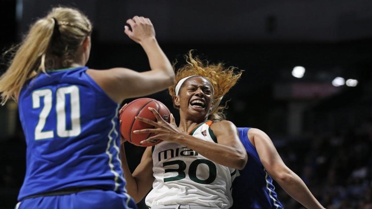 Miami Hurricanes forward Erykah Davenport (30) drives to the basket against Florida Gulf Coast in the NCAA Division 1 Women's Basketball Championship on Saturday, March 18, 2017. UM’s men’s and women’s basketball programs relocated to Georgia to avoid Hurricane Irma. Now, both teams are in Orlando and awaiting their return to Coral Gables.