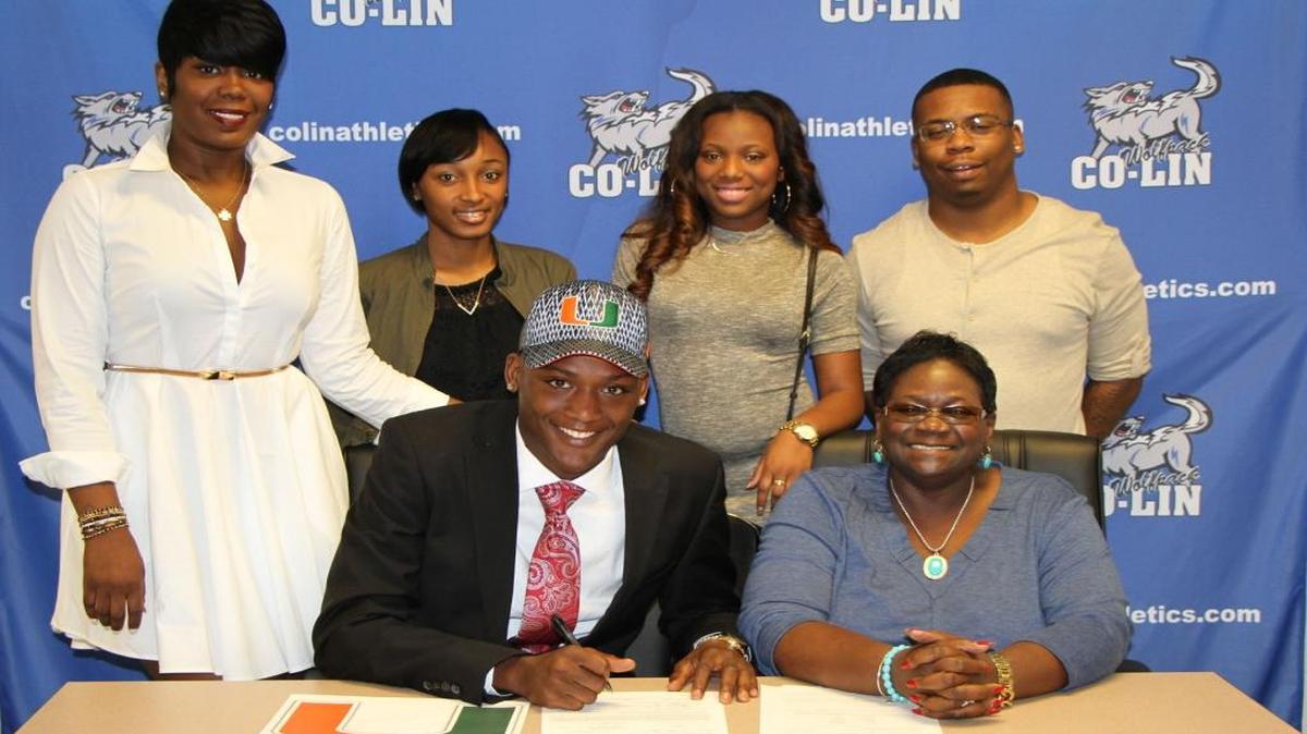 New UM signee Dayall Harris (center) poses with (clockwise from top left): his mother Lafallia Harris, girlfriend Oquandra McGowan, sister Kadasha Ratliff, Ron Cobbs, and grandmother Shirley Hampton.