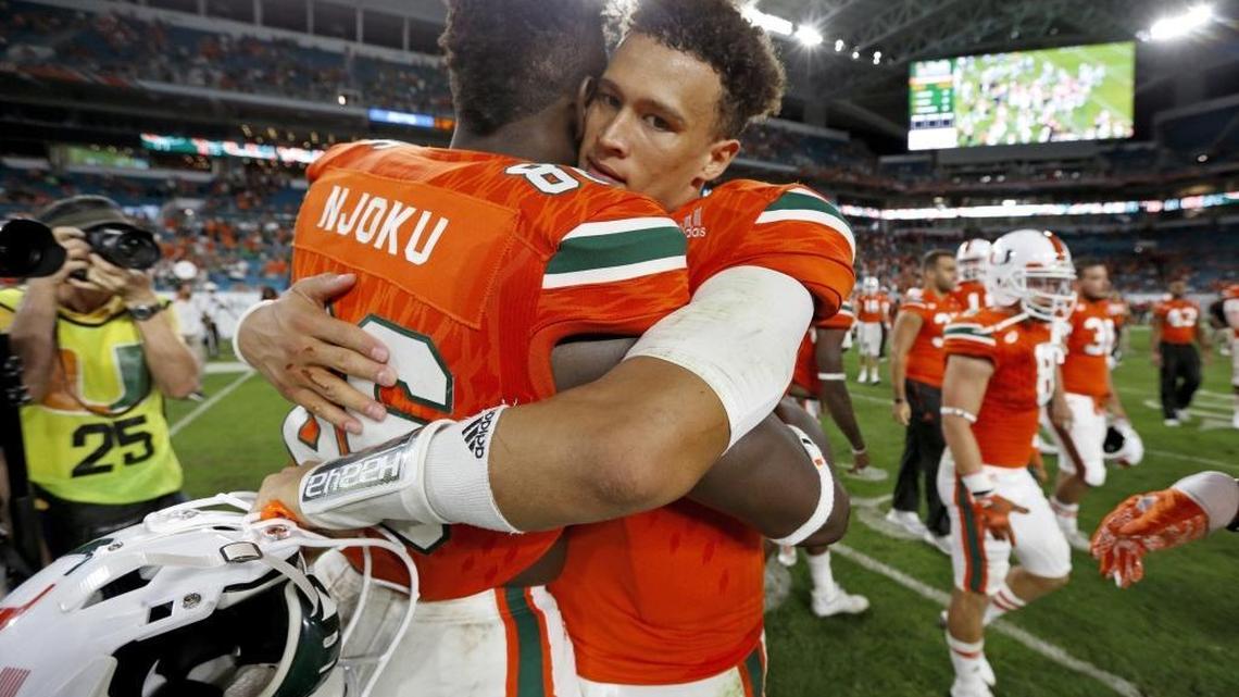 Miami Hurricanes tight end David Njoku (86) hugs quarterback Brad Kaaya (15) after the University of Miami defeats Duke at Hard Rock Stadium in Miami Gardens on Saturday, November 26, 2016. Both will be at the 2017 NFL Scouting Combine Feb. 28 to March 6 in Indianapolis.