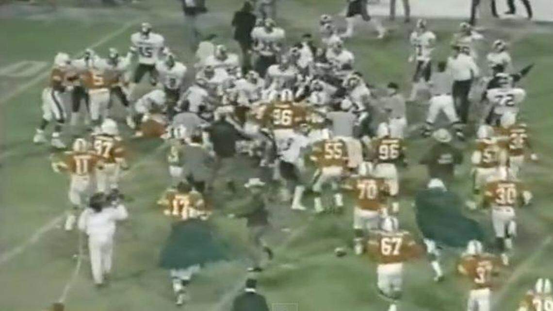 
A screen shot from the ESPN broadcast shows the bench-clearing brawl that ensued after the Canes’ Dan Stubbs threw quarterback Todd Ellis to the ground during the 1987 UM-South Carolina game. Afterwards, Gamecocks athletic director Bob Marcum said South Carolina would not play Miami anymore. 

