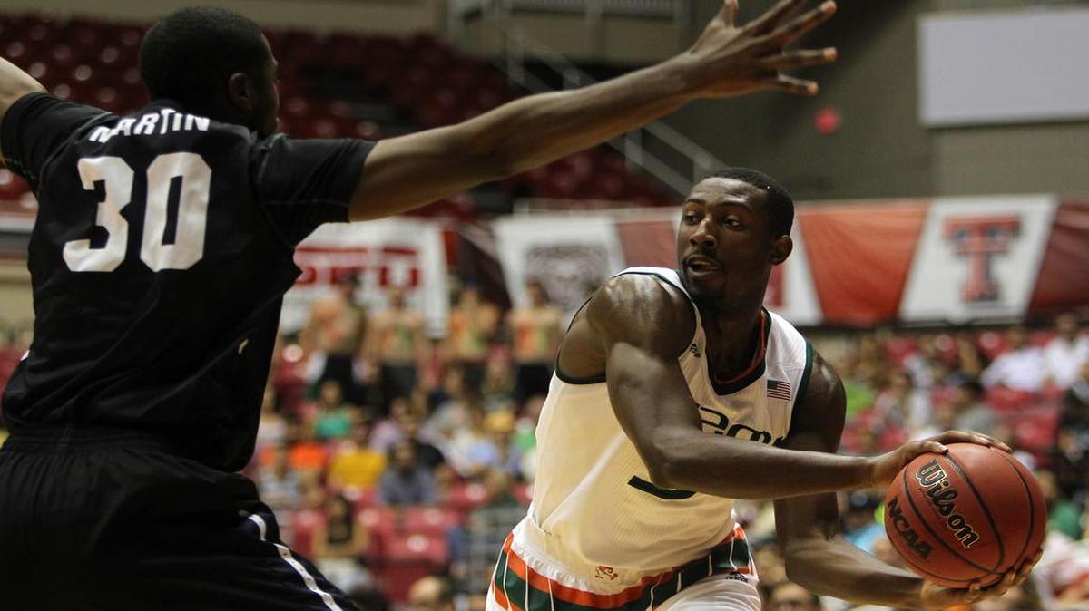 Butler forward Kelan Martin, left, pressures Miami guard Davon Reed during the Puerto Rico Tip-Off college basketball tournament in San Juan, Sunday, Nov. 22, 2015.