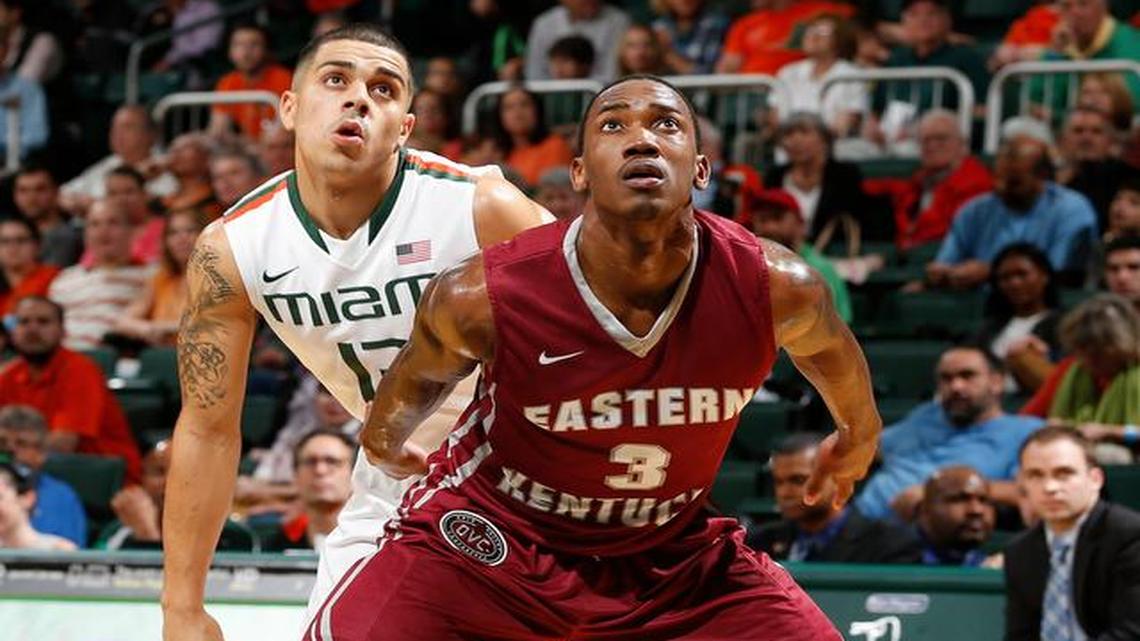 
Eastern Kentucky’s Denzel Richardson (3) blocks out Miami’s Angel Rodriguez (13) as they wait for a rebound on a free throw during the first half of an NCAA college basketball game in Coral Gables on Dec. 19, 2014.
