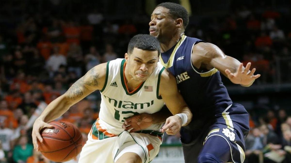 Miami guard Angel Rodriguez (13) drives against Notre Dame guard Demetrius Jackson (11) in the first half of an NCAA college basketball game, Wednesday, Feb. 3, 2016, Coral Gables, Fla. Miami won 79-70.