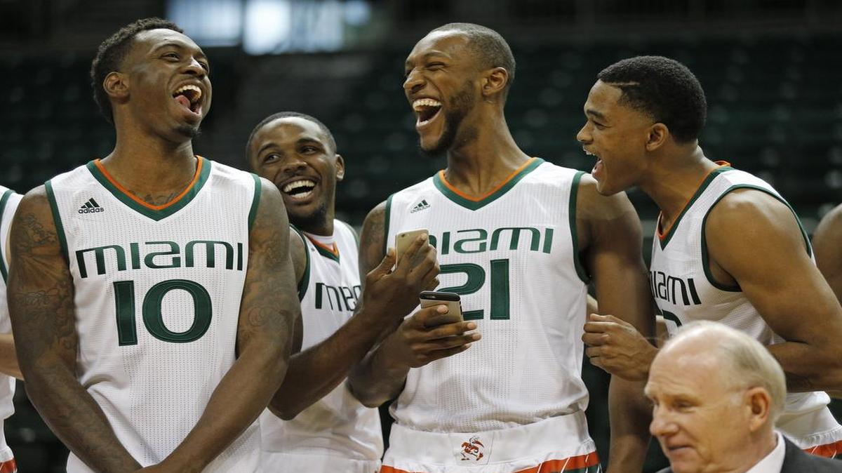 Sheldon McClellan, (10), Ja'Quan Newton, (0), Kamari Murphy, (21), and James Palmer, (12), left to right, share a laugh during media day for the University of Miami men's basketball team at the BankUnited Center arena on Tuesday, October 13, 2015.
