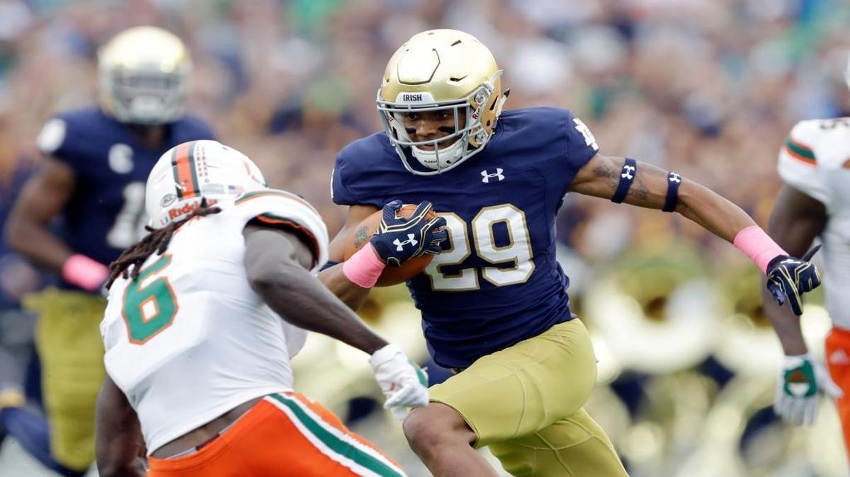 Notre Dame 's Kevin Stepherson (29) runs past Miami 's Jamal Carter Sr. (6) during the first half of an NCAA college football game Saturday, Oct. 29, 2016, in South Bend, Ind.