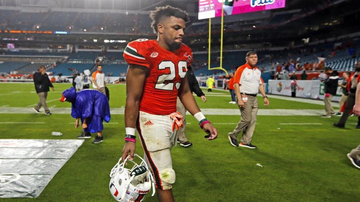 Miami Hurricanes defensive back Corn Elder (29) walks off the field after the Hurricanes lose to the University of North Carolina Tar Heels at Hard Rock Stadium on Saturday, October 15, 2016.