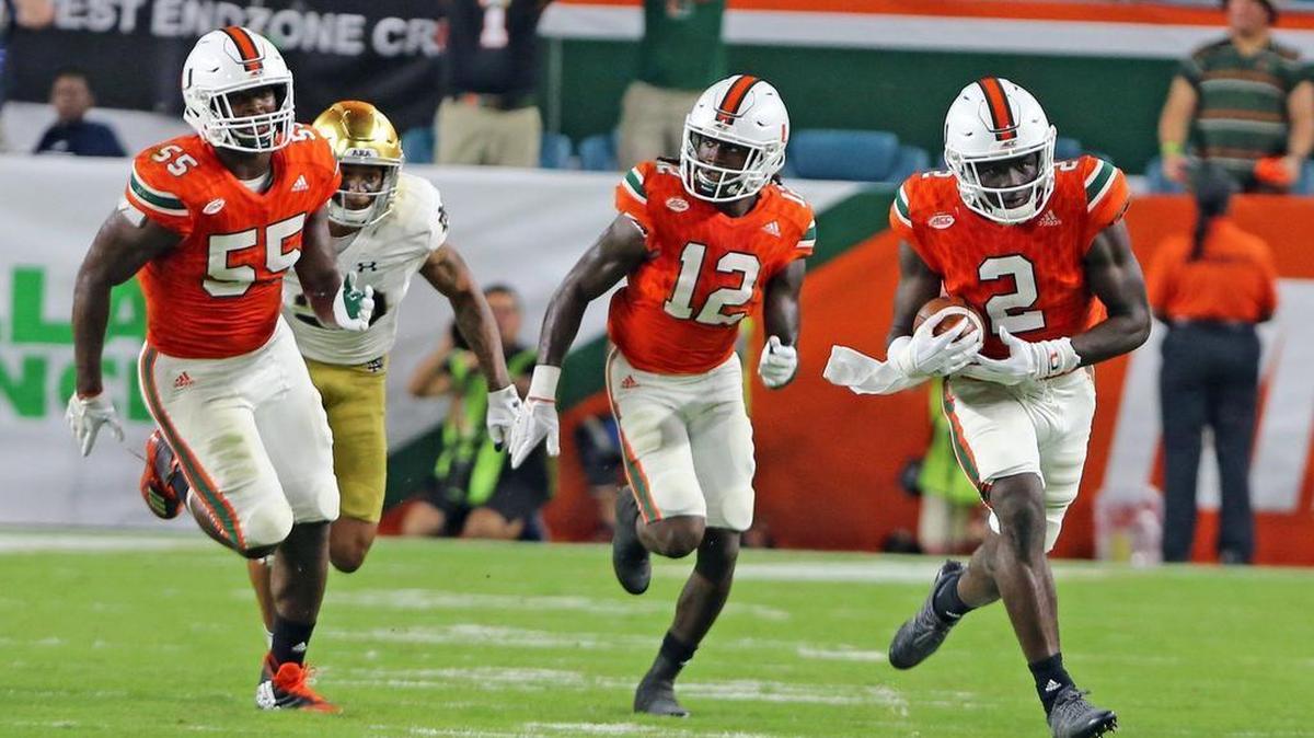 Miami Hurricanes cornerback Trajan Bandy (2) returns an interception for a touchdown against Notre Dame at Hard Rock Stadium in Miami Gardens, Florida, Nov. 11, 2017.