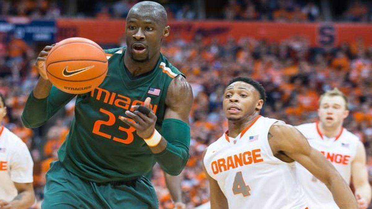 
Tonye Jekiri of the Miami Hurricanes gathers a loose ball against Syracuse on Jan. 24, 2015 at the Carrier Dome in Syracuse, New York. 
