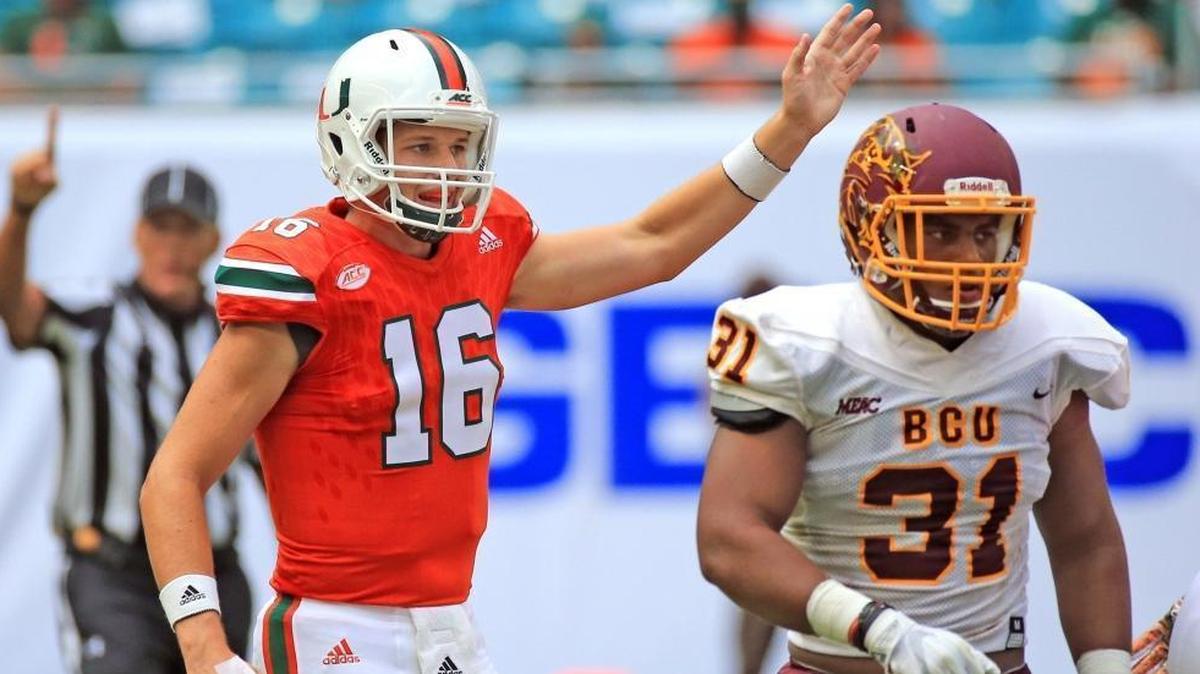 Miami Hurricanes quarterback Evan Shirreffs (16) signals a first down in the fourth quarter as the University of Miami hosts Bethune-Cookman at Hard Rock Stadium on Sat., Sept. 2, 2017.