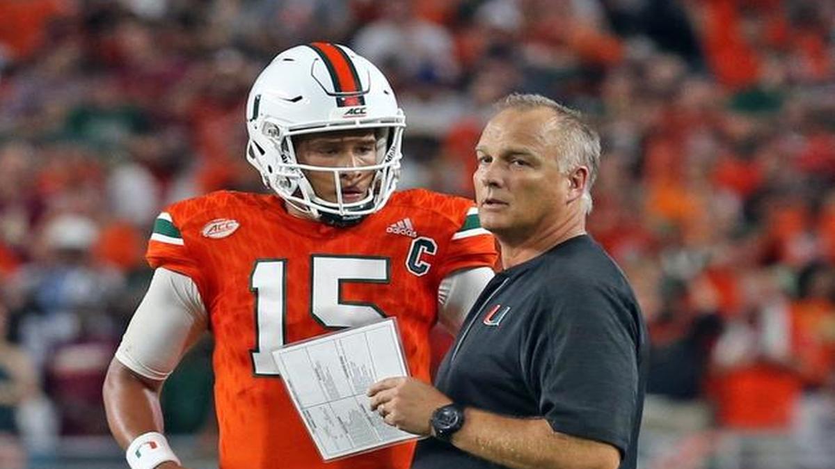 Miami Hurricanes' coach Mark Richt talks with quarterback Brad Kaaya in the second quarter as they play Florida State Seminoles' at Hard Rock Stadium in Miami Gardens, Florida, October 8, 2016.