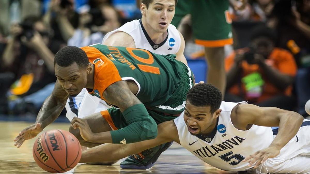 Miami’s Sheldon McClellan (10) and Villanova’s Phil Booth (5) scramble for a loose ball in the second half during a Sweet 16 matchup in the NCAA Tournament’s South region at the KFC Yum! Center in Louisville, Ky., on Thursday, March 24, 2016. Villanova advanced, 92-69.