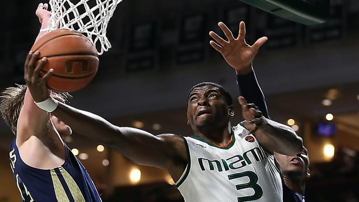 Miami's Anthony Lawrence, Jr. (3) goes to the basket past Tech's Ben Lammers (44) as the University of Miami plays host to Georgia Tech on Wed., Feb. 15, 2017.