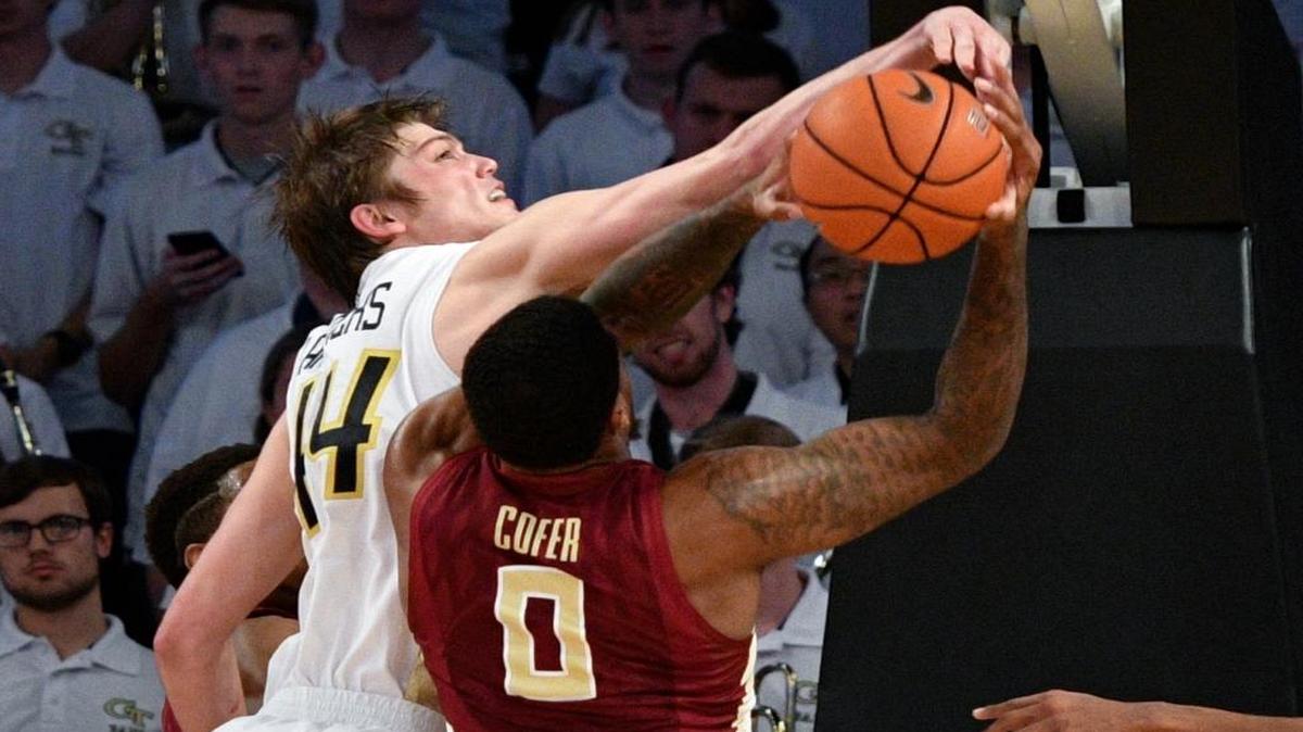 Georgia Tech center Ben Lammers gets his hand on the shot of Florida State forward Phil Cofer during the second half of an NCAA basketball game Wed., Jan. 25, 2017, in Atlanta. Georgia Tech won 78-56.