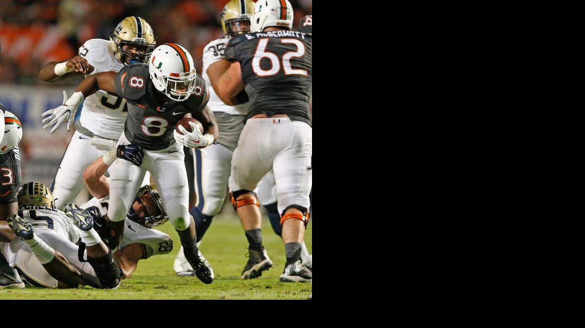 
Will he stay or will he go? Hurricanes running back Duke Johnson said he will announce Sunday whether he will enter the 2015 NFL Draft.
