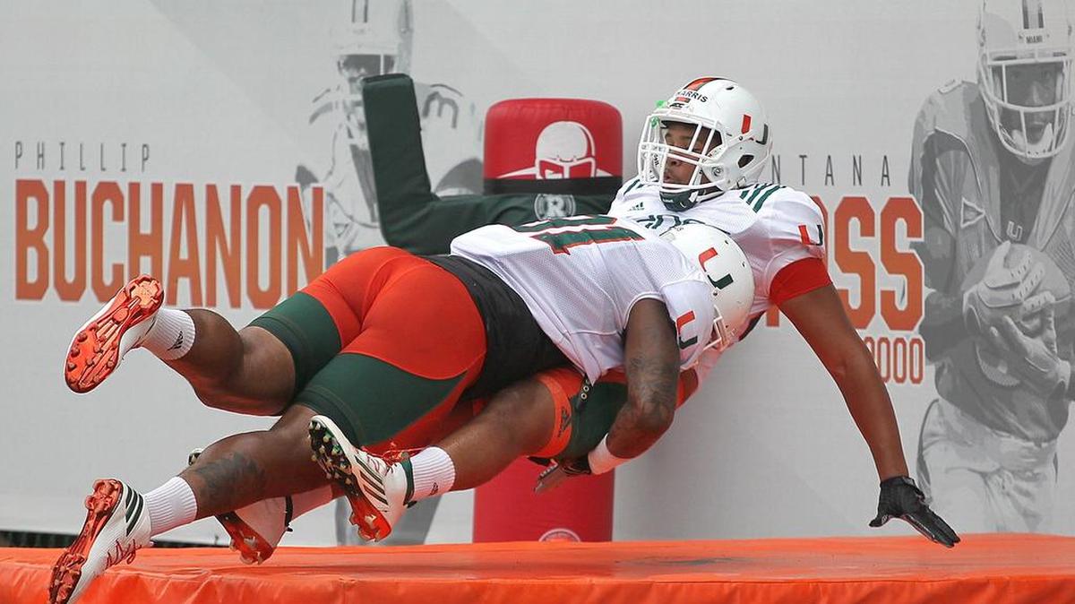 Gerald Willis, left, tackles Trent Harris, right, during practice drills on Thursday, August 11, 2016 at Greentree Field in Coral Gables. Willis is dominating as a scout-teamer in practice this season after what UM called “a leave of absence.’’