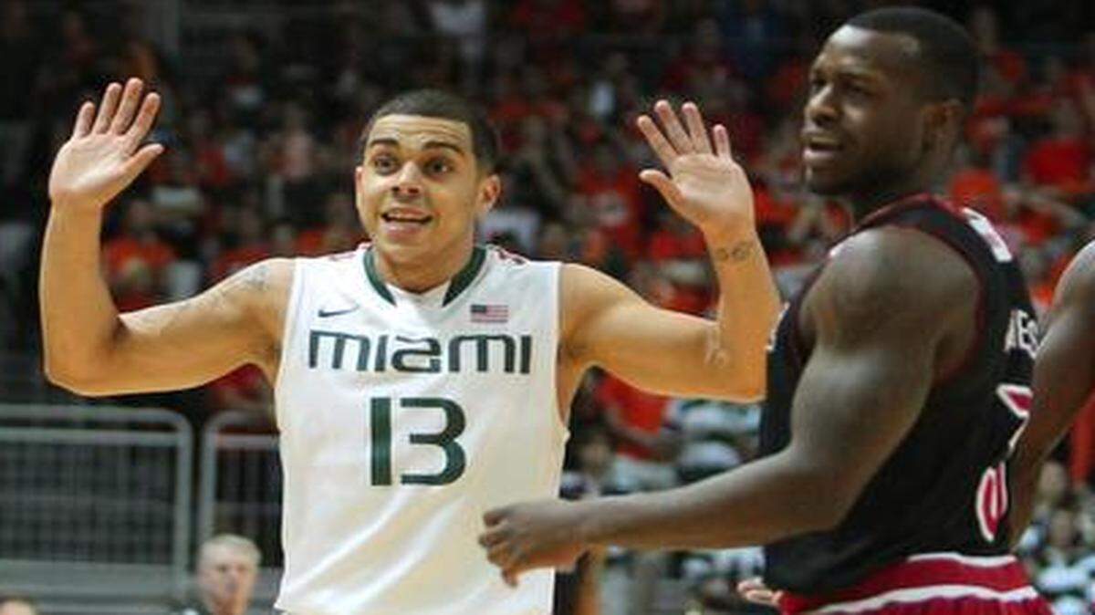 
Miami Hurricanes guard Angel Rodriguez reacts after a play during the first half against Louisville at BankUnited Center in Coral Gables on Tuesday, Feb. 3, 2015.
