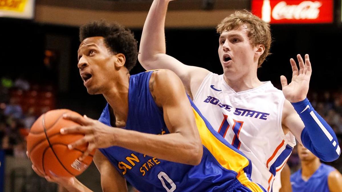 San Jose State’s Rashad Muhammad (0) looks to the basket as Boise State’s Jeff Elorriaga (11) defends during a game in Boise, Idaho, Saturday, Jan. 25, 2014.
