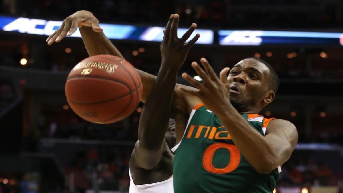 Miami's Ja'Quan Newton (0) tries to pull in a rebound in front of Virginia's Marial Shayok (4) during the second half of Virginia's 73-68 victory over Miami in the semifinals of the 2016 New York Life ACC Tournament at the Verizon Center in Washington, D.C., Friday, March 11, 2016.