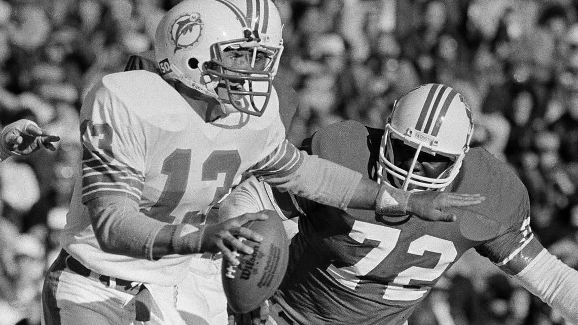 Former Carol City and University of Miami star Lester Williams chases down then-Miami Dolphins rookie quarterback Dan Marino on Nov. 14, 1983.