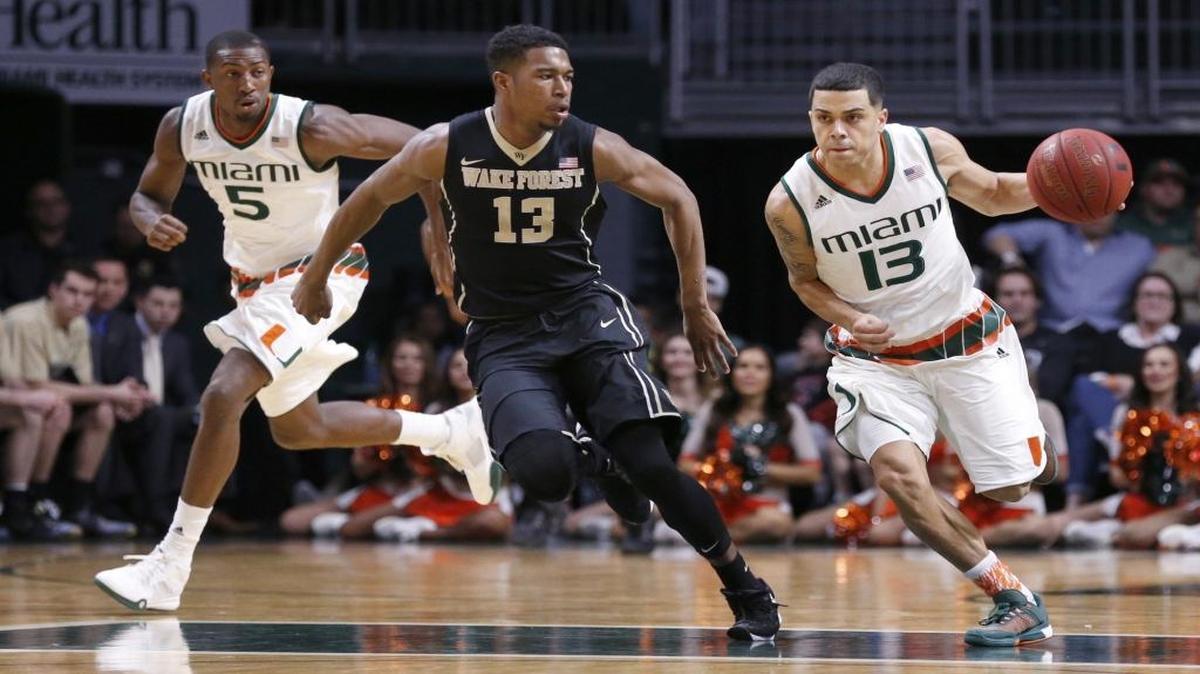 Miami (Fl) Hurricanes guard Angel Rodriguez (13) drives the ball as Wake Forest Demon Deacons guard Bryant Crawford (13) defends as the University of Miami men's basketball team hosts Wake Forest at BankUnited Center on Saturday, January 23, 2016.