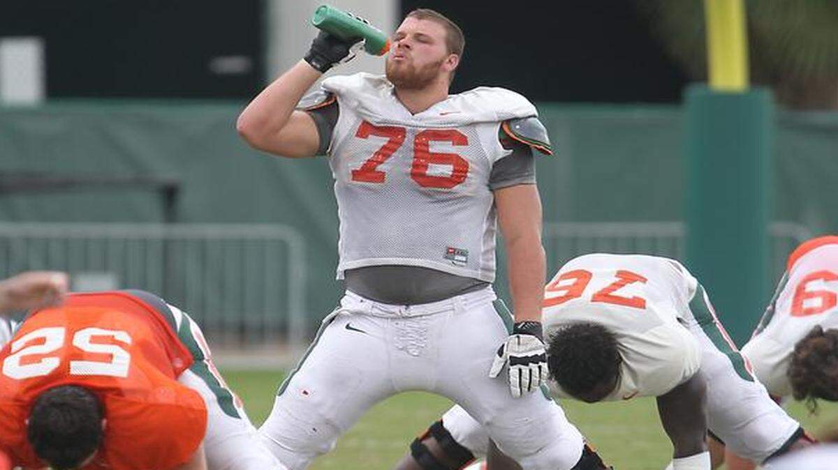 
UM offensive lineman Taylor Gadbois stretches during practice Aug. 24, 2014.
