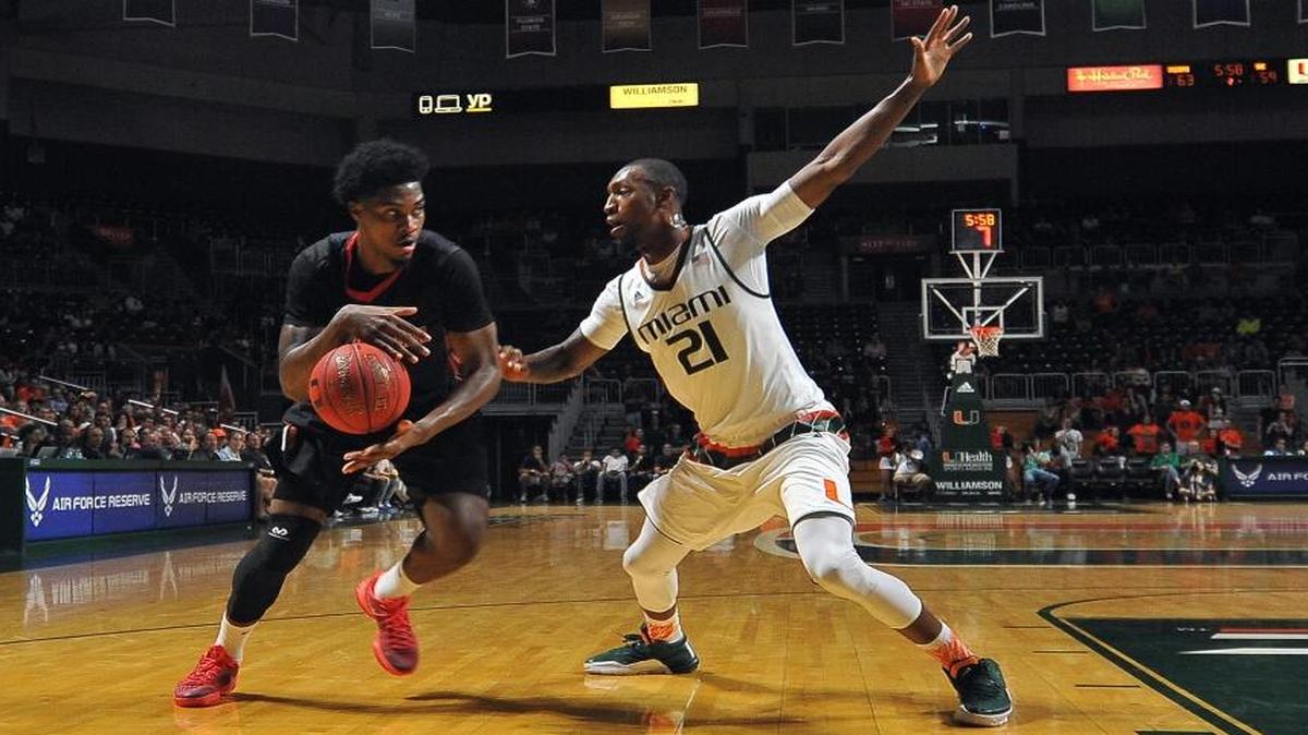 UM’s Kamari Murphy (21) defends Northeastern’s Quincy Ford during the second half in Coral Gables, Fla., Friday, Nov. 27, 2015.