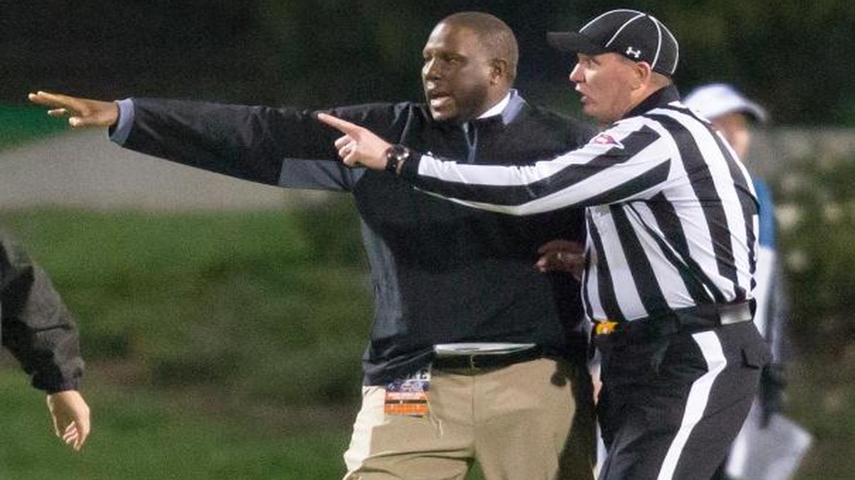 UM interim coach Larry Scott speaks with referee Tracy Lynch after a kickoff return with eight laterals that ended in a touchdown to give Miami a 30-27 win over Duke on Saturday, Oct. 31, 2015 in Durham, N.C.