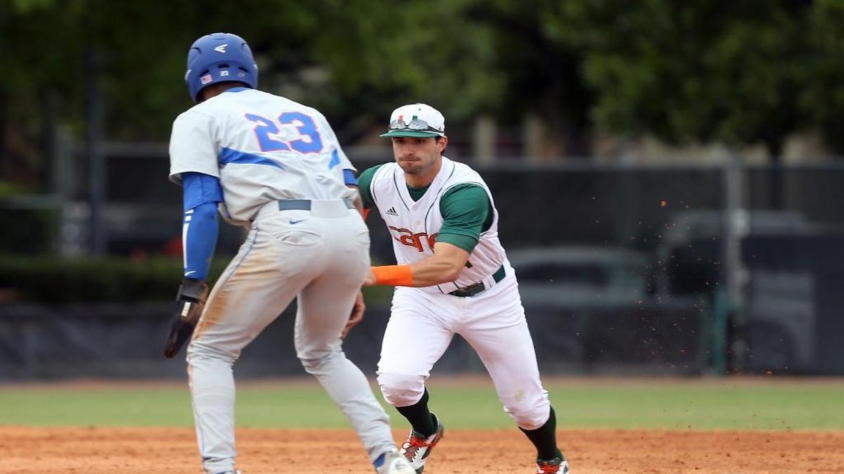Miami's #4 Johnny Ruiz tags out Florida's #23 Buddy Reed as the University of Miami baseball team plays the University of Florida on Sunday February 28, 2016.