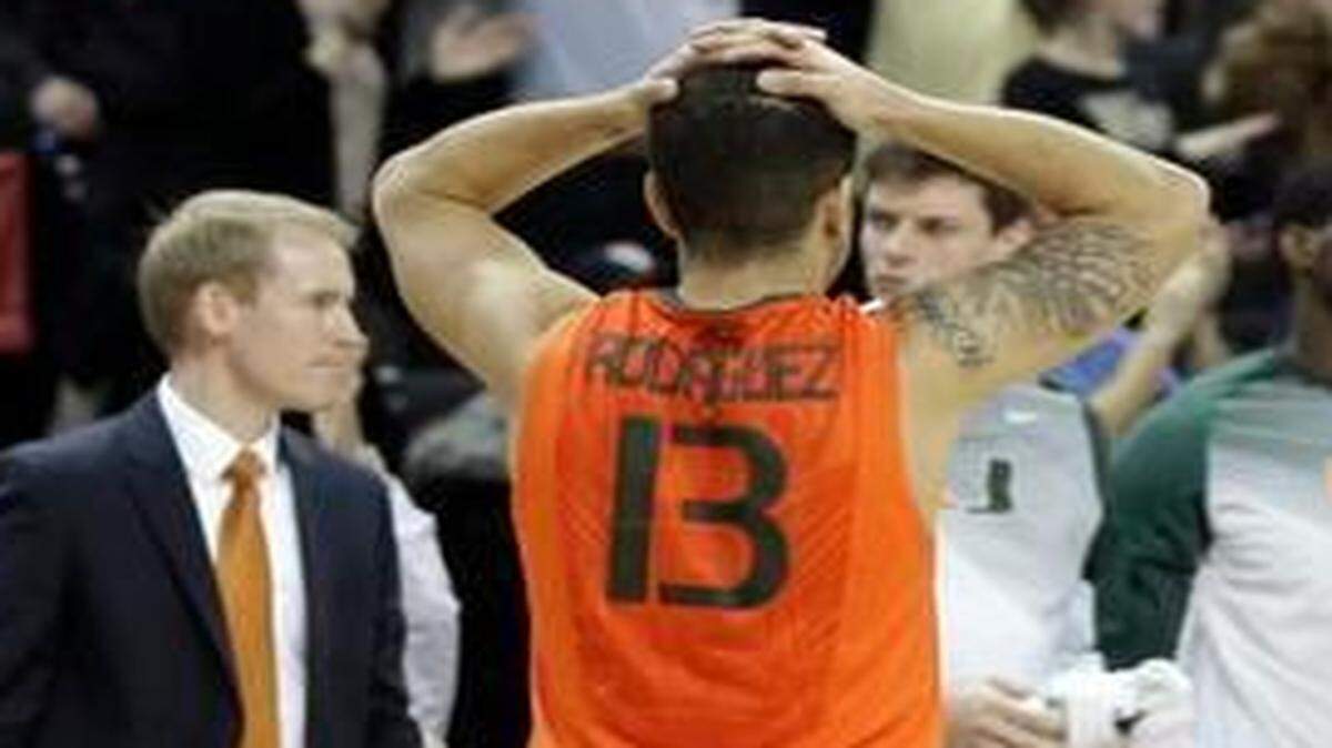 
Miami’s Angel Rodriguez (13) reacts after missing a last-minute shot against Wake Forest in Winston-Salem, N.C., Wednesday, Feb. 11, 2015. Wake Forest won 72-70. 
