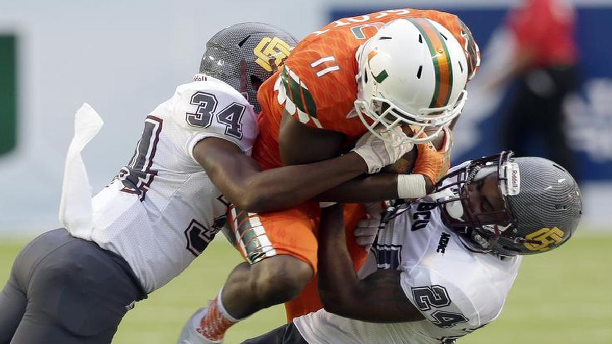 UM receiver Rashawn Scott makes one of his six catches Saturday, Sept. 5, 2015 against Bethune-Cookman at Sun Life Stadium in Miami.
