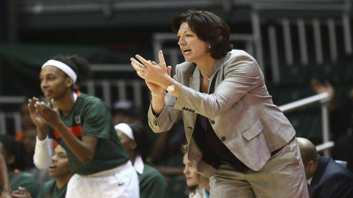 
FILE - In this Feb. 13, 2014, file photo, Miami coach Katie Meier yells instructions to her team during the first half of an NCAA college basketball game against Maryland in Coral Gables, Fla. Meier earned her 250th career victory when Miami beat Boston College 74-53 on Sunday, Jan. 1, 2015, at the BankUnited Center in Coral Gables, Fla.
