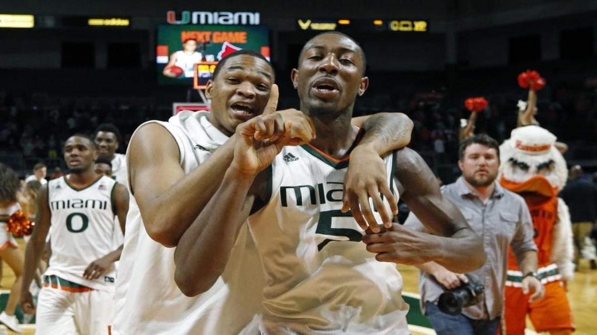Miami Hurricanes guard James Palmer (12) and guard Davon Reed (5) celebrate as the University of Miami defeated Virginia at the BankUnited Center on Monday, February 22, 2016.