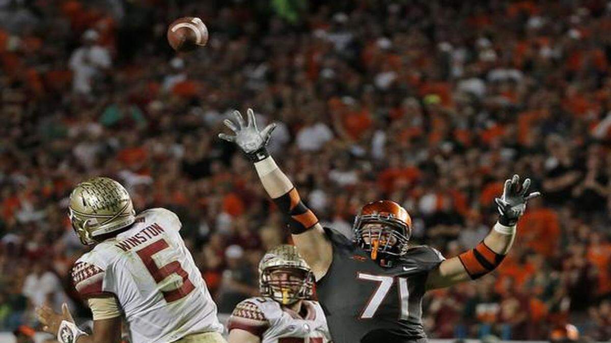 
Letting it slip away: The Hurricanes had quarterback Jameis Winston and undefeated FSU on the ropes, but were unable to put the Seminoles away.

